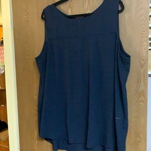 Sleeveless top with mesh across top and pin dot detailing.